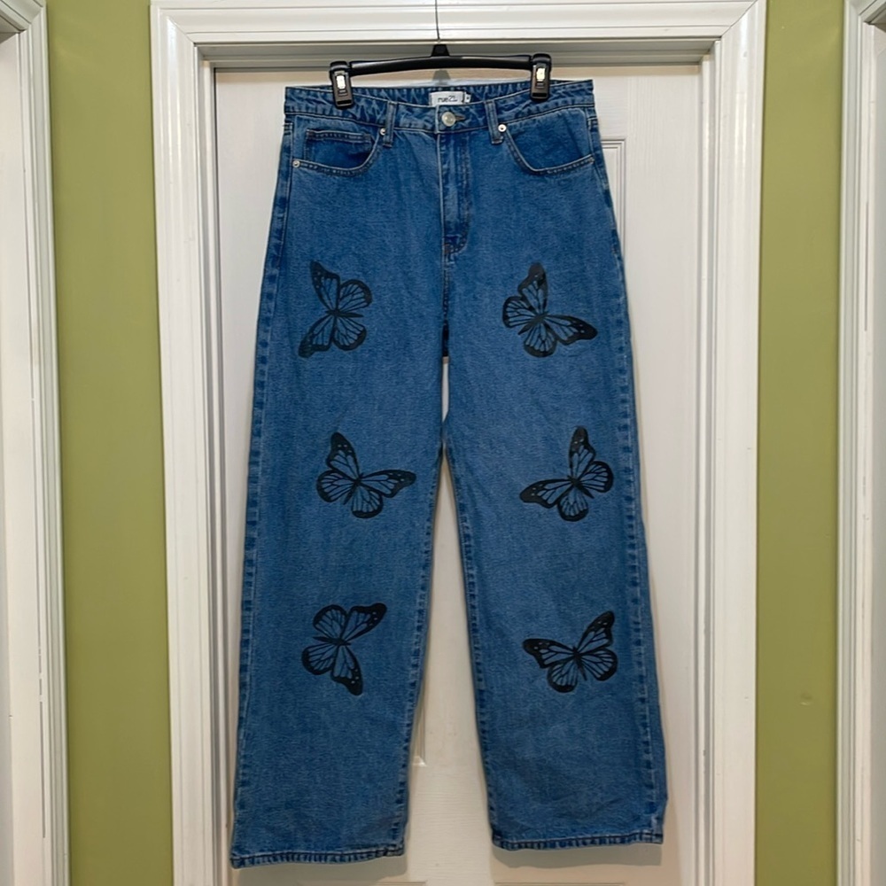 Rue 21 - medium wash blue jeans with black butterfly prints - sizer 16